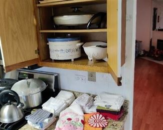 electric kitchen appliances, bakeware, pots and pans, towels and rags
