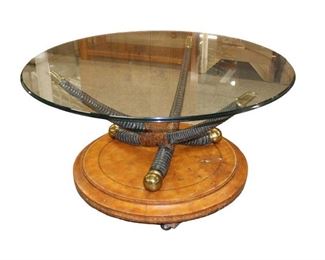 
Lot 525
Tagged Maitland Smith 44" diameter glass top leather base with horn style decoration cocktail table
