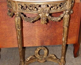 
Lot 555
Antique French highly carved gold gilt marble top console, some finish loss
