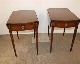 
Lot 566
Pair of Vintage mahogany 1 drawer drop side Pembroke tables with bell flower inlay
