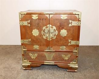 
Lot 568
Asian inspired burl walnut and mahogany brass strapped chest
