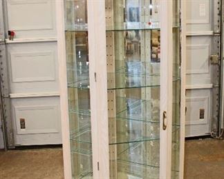 
Lot 594
Contemporary Philip Reinisch bevel glass 1 door corner curio display cabinet
