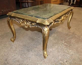 
Lot 601
Gold gilt frame marble top coffee table
