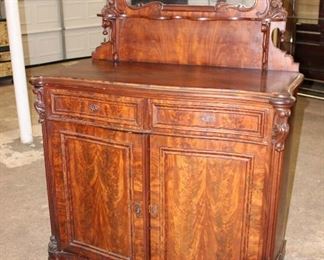 
Lot 624
Antique Victorian walnut 2 drawer 2 door fancy mirror top server, missing molding on one side
