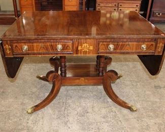
Lot 631
Baker Regency style burl walnut drop side 2 drawer table with inlay, some inlay loss
