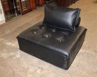 
Lot 648
Modular cube accent seat in the black leather style with back and cushion
