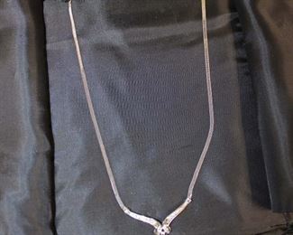 
Lot 671
Pink Topaz and diamond 10K white gold necklace approx. 16"
