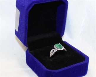 
Lot 686
1.25 Colombian emerald and .15ct white sapphire 925 sterling silver ring size 6.5
