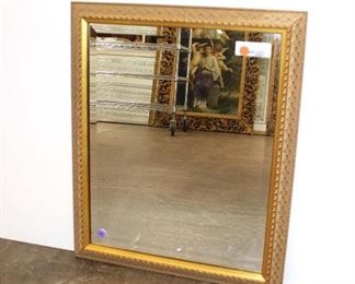 
Lot 765
Carved fancy gold frame bevel glass mirror approx. 19" w x 24" h
