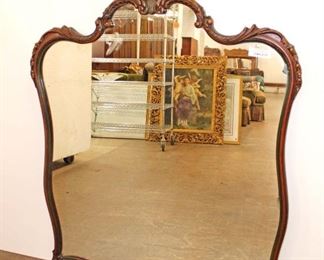 
Lot 770
Vintage carved frame mahogany mirror approx. 36" w x 45" h
