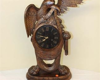 
Lot 774
Hand carved mahogany eagle mantle clock with key and pendulum approx. 15" w x 7" d x 26" h
