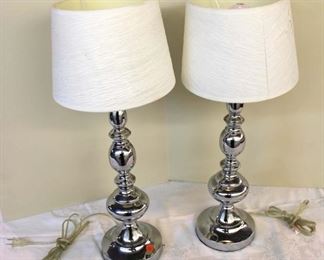
Lot 783
Pair of modern style chrome base lamps, 1 shade has small tear approx. 6" diameter x 24" h
