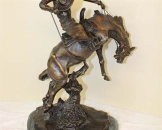 
Lot 787
Bronze of marble restrike signed CM Russel titled "Bronco Twister", leg of horse missing, not attached to marble approx. 16" w x 10" d x 25" h

