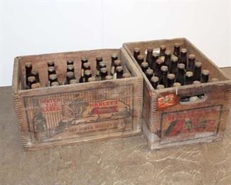 
Lot 791
2 Cases of Antique Hanley's beer in wooden dovetail crates with Pennsylvania Tax Stamp on bottle caps, original Peerless art on crates, all in original found condition approx. 48 bottles

