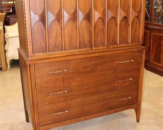 
Lot 807
Mid century Modern Kent Coffey fitted interior chest on chest in the walnut and pecan
