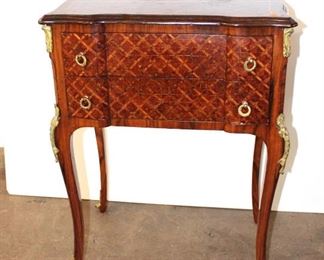 
Lot 808
Semi antique French style 2 drawer stand with parquet inlay top and applied bronze
