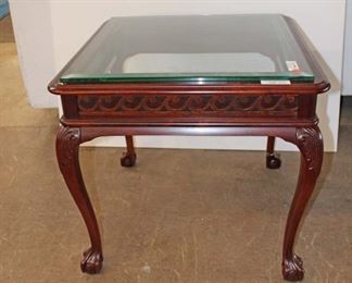 
Lot 809
Contemporary mahogany glass top lamp table with ball and claw feet, Glass is not original to Table
