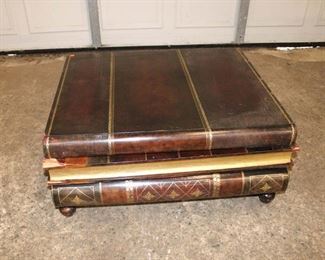 
Lot 817
Maitland Smith leather wrapped faux book style coffee table, has damage to corners
