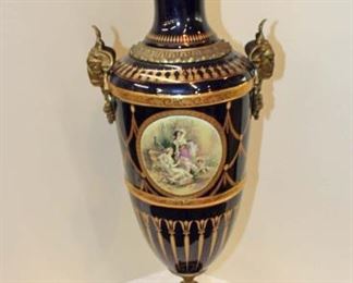 
Lot 828
Beautiful Sevres style French porcelain urn with applied bronze in the hand painted/transfer gold leaf
