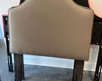 Two brown fabric twin headboards