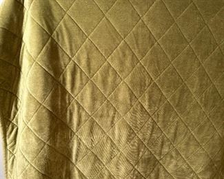 Green quilted throw with fleece backing
