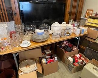 Assortment of glassware including tea cups, vases, punch bowls, serving dishes, etc.