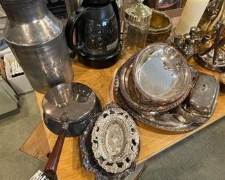 Assortment of silver cutlery, serving dishes, butter dish.