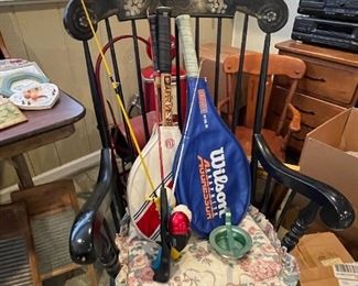 Antique wooden rocker, Wilson tennis rackets, child fishing rods.