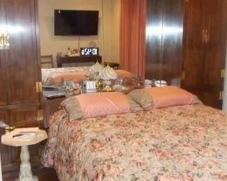 Asian influence queen bed with mirror and double side cabinets, Saatva premium mattress and remote adjusting bed with massage