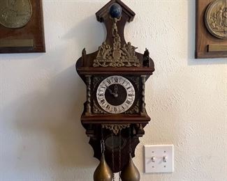Gorgeous wood clock… with original brass balls. Cool and rare piece… sure to impress the clock aficionados in your life.