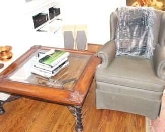 Coffee table and wing back chair.