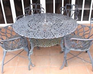 Round patio table and four chairs.