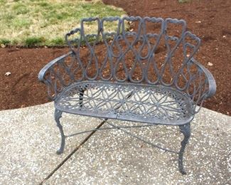 Black iron settee.
