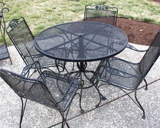 Round patio table and four chairs.