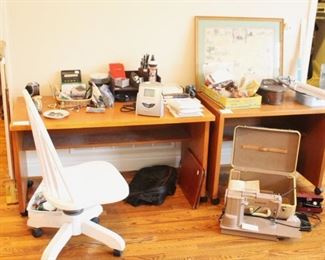 Two desks and office supplies.