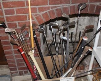 Misc. golf clubs and bats.