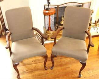 Pair of wood armed chairs.