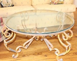 Glass top, iron base round coffee table.