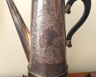John Seymour silver on copper hand chased coffee pot.