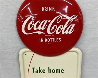 CLOSEUP W/ COCA COLA BUTTON