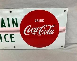 CLOSEUP RIGHTSIDE COKE SIGN