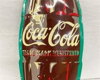 CLOSEUP CONVEX COKE BOTTLE