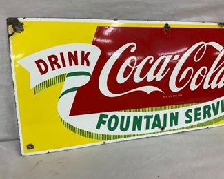 CLOSEUP LEFTSIDE COKE SIGN