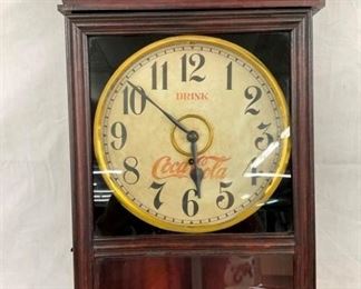 CLOSEUP TOP COKE WALL CLOCK