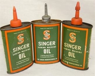 BACK VIEW SINGER OIL TINS