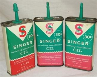 BACK VIEW SINGER OIL TINS