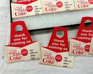 CLOSE UP VIEW COCA-COLA BOTTLE TOPPERS