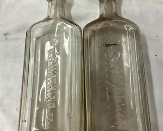 CLOSE UP VIEW EMB. WATKINS BOTTLES 