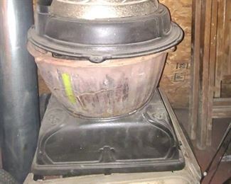 1 of 2 Pictures - Vintage Cast iron stove with chrome trim.