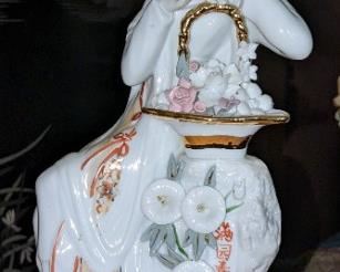 Porcelain statue.